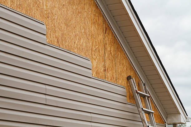 Professional Siding Contractor technician working in Hallwood, VA